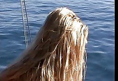 Beautiful blonde with great tits fucks outside on a boat and tropical island