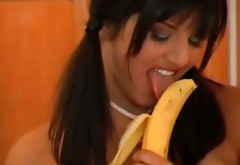 Busty brunette with pigtails Sunny Leone fucks her pussy with banana